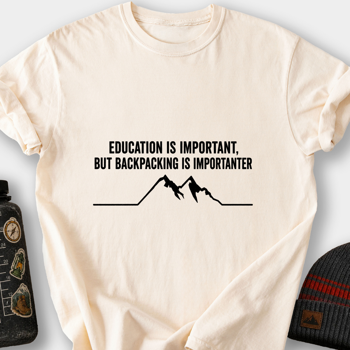 Education Is Important, But Backpacking Is Importanter T-Shirt — Ivory