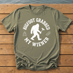 Bigfoot Grabbed My Wiener (Varsity) T-Shirt — Moss