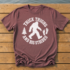 bigfoot thick thighs varsity badge T-Shirt — Brick