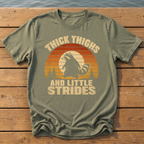 raccoon thick thighs little strides sunset slat T-Shirt — Moss