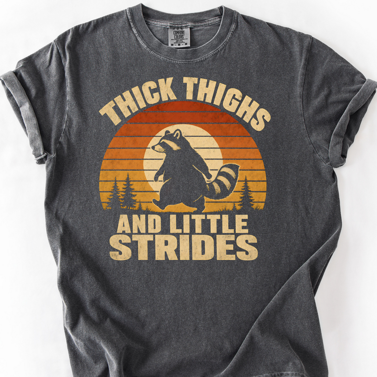 Thick Thighs and Little Strides (Raccoon) T-Shirt — Pepper